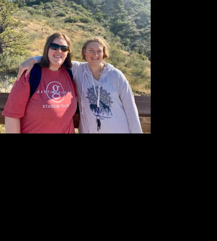 Two Students pose for a photo while hiking